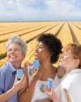 Three women in tulip fields with Bloomeffects Tulip Dew Shield & Glow