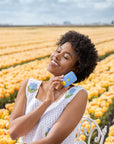 Girl in tulip fields with Bloomeffects Tulip Dew Shield & Glow