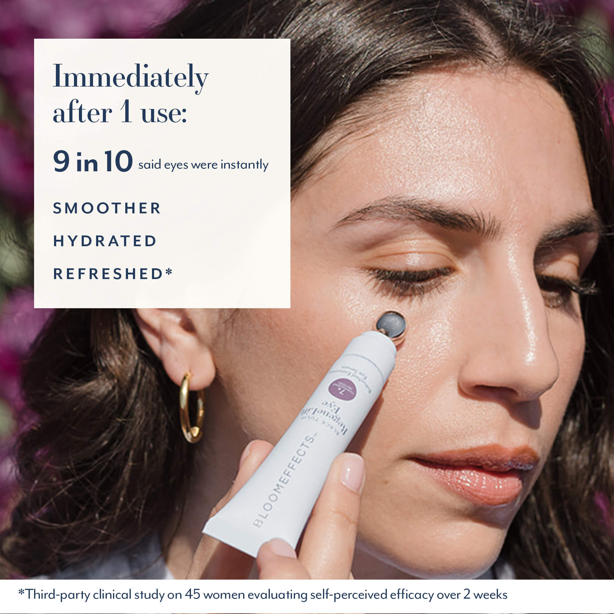 Close-up of a woman applying a small white skincare tube to her eye area, with text on the left reading 'Immediately after 1 use: 9 in 10 said eyes were instantly smoother, hydrated, refreshed'.
