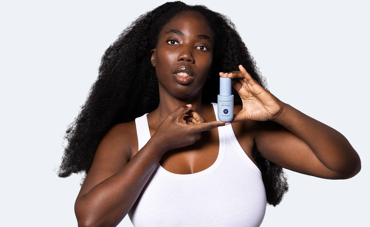 Woman holding Bloomeffects Dew Drops