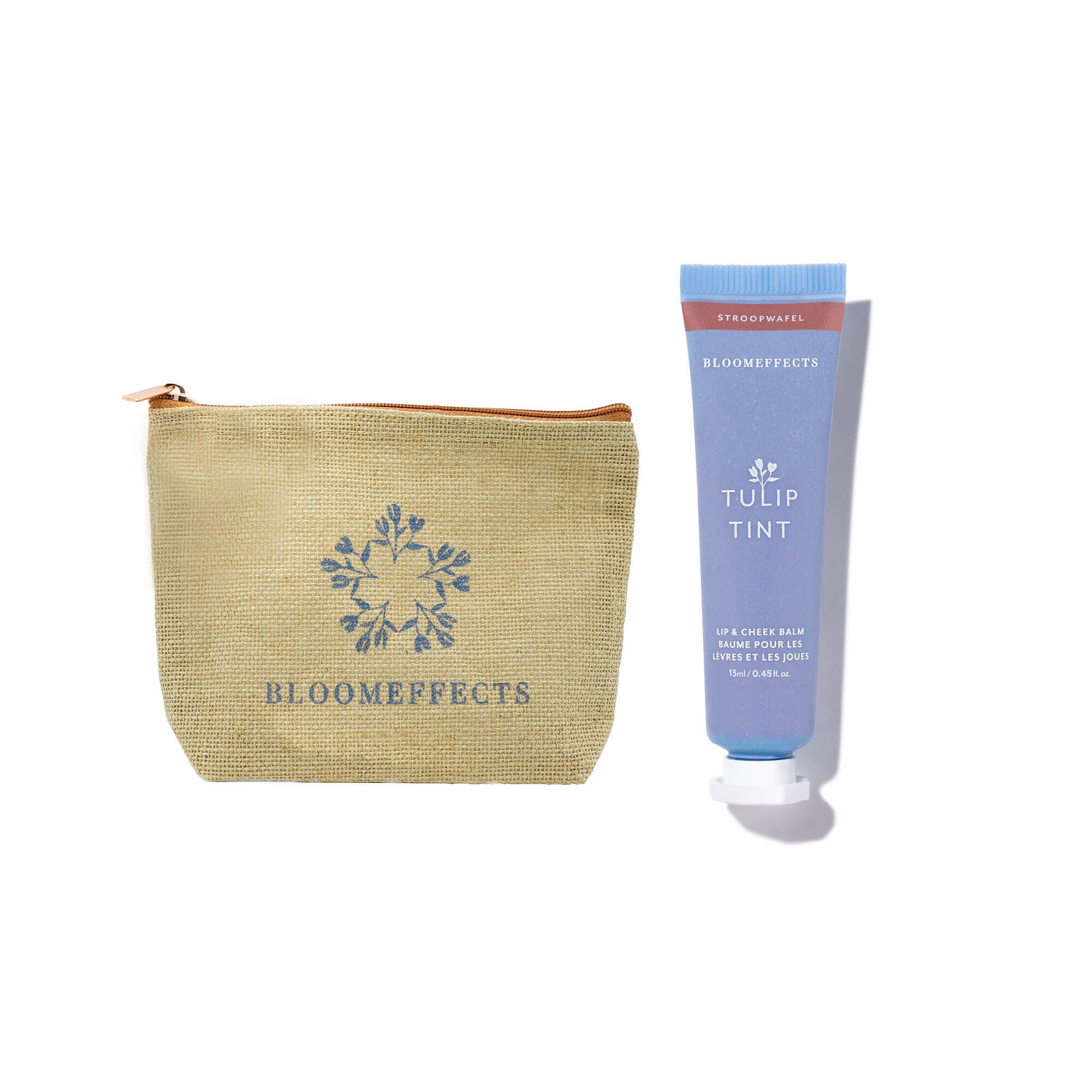 Bloomeffects cosmetic bag and tube of Tulip Tint on a white background