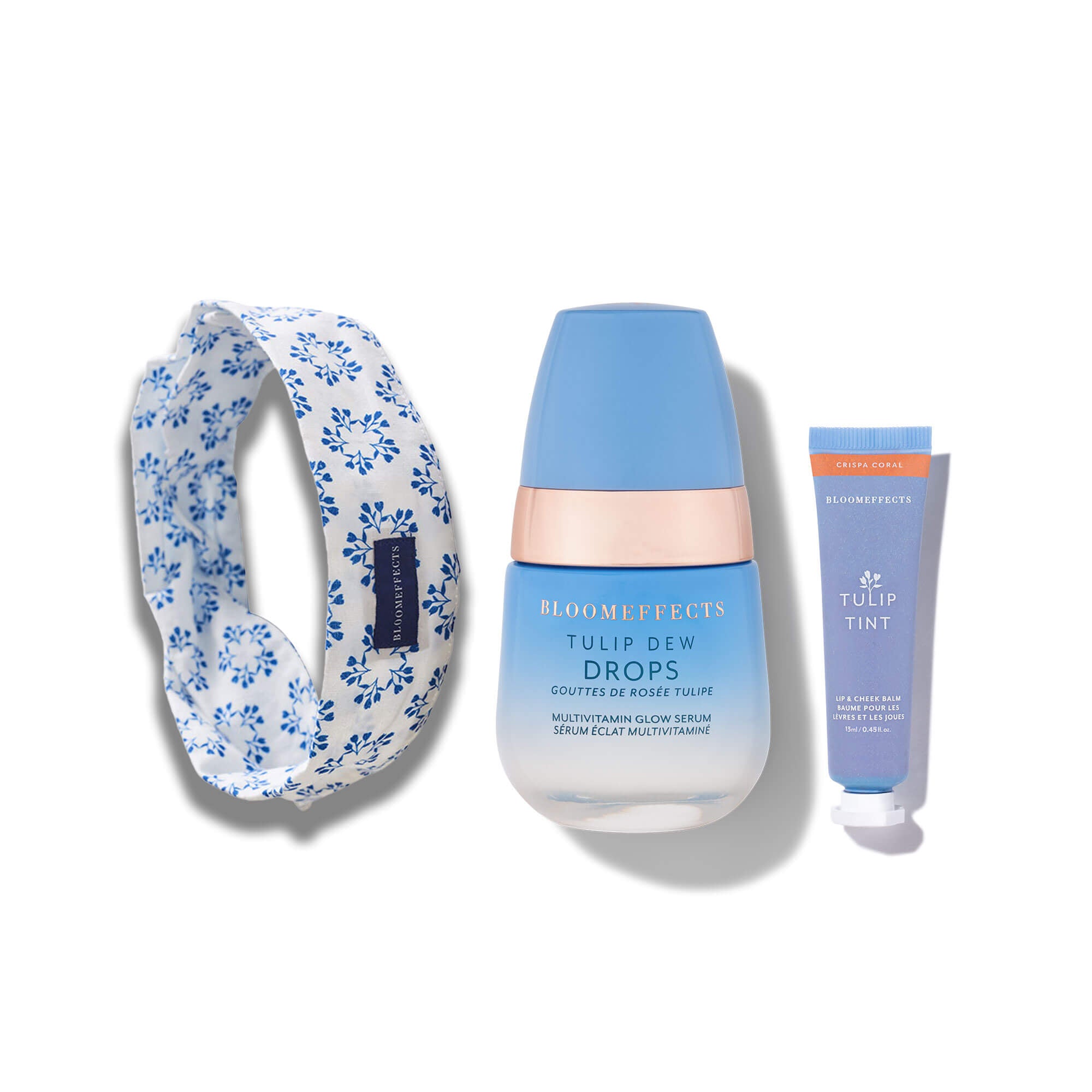 Beauty product set with dew Drops, Tulip Tint, and headband on a white background